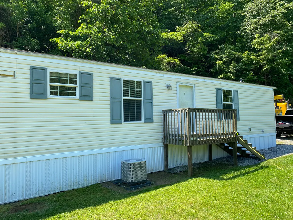 Clean mobile home exterior after pressure washing