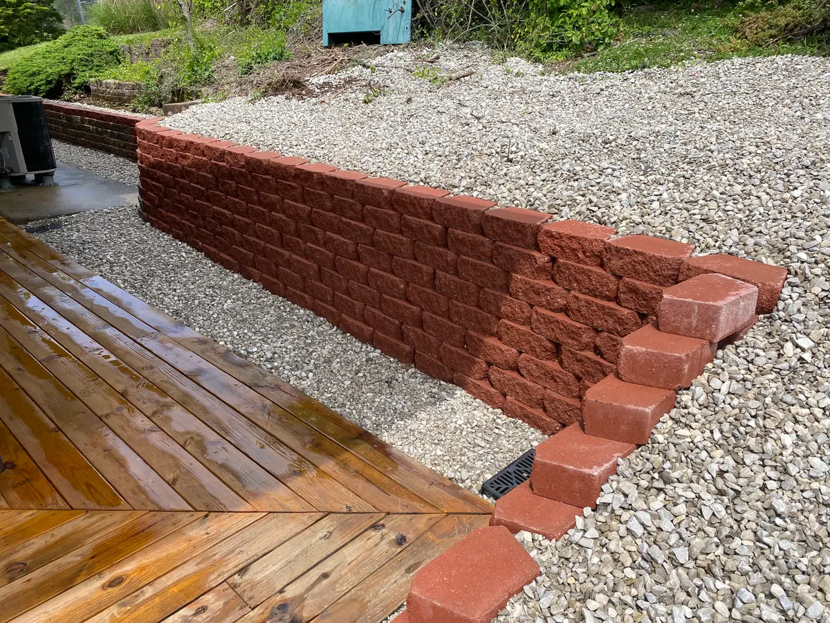 Completed block retaining wall built by 4 Seasons